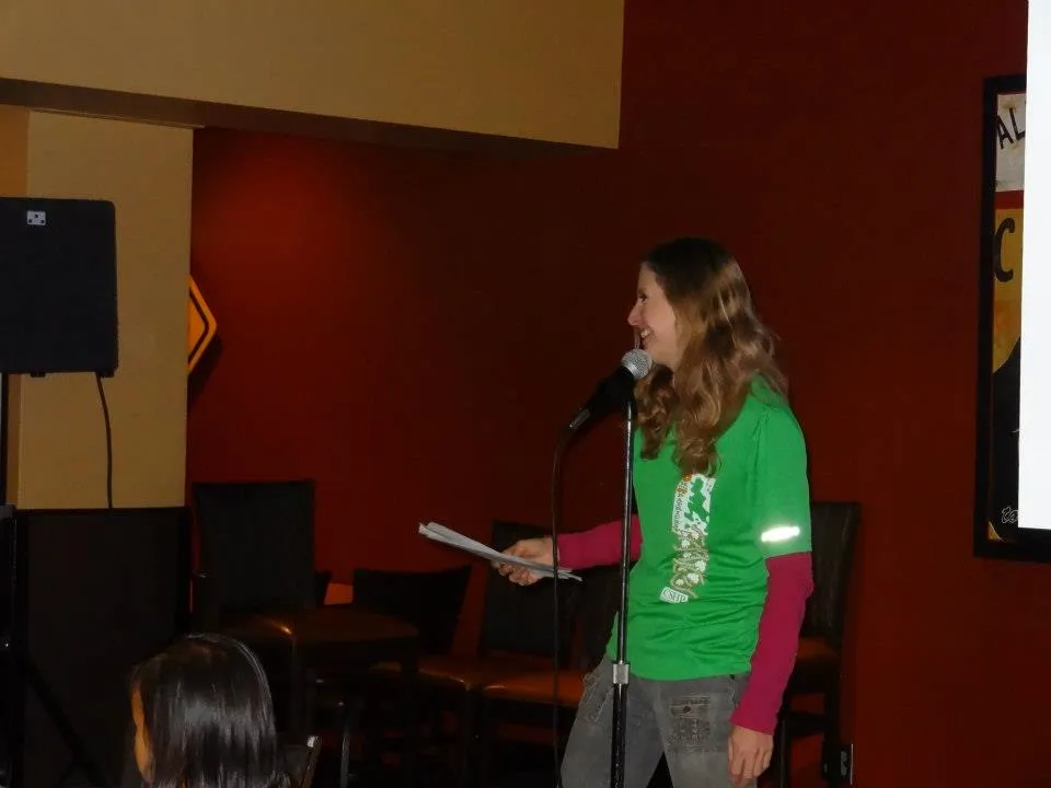 UCCS GeoClub member Kami McFall asks the crowd a geography question.