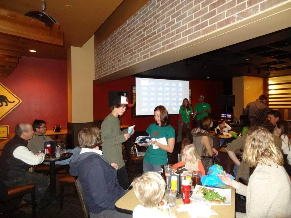 Geoclub member Kelli hands out prizes to a lucky winner
